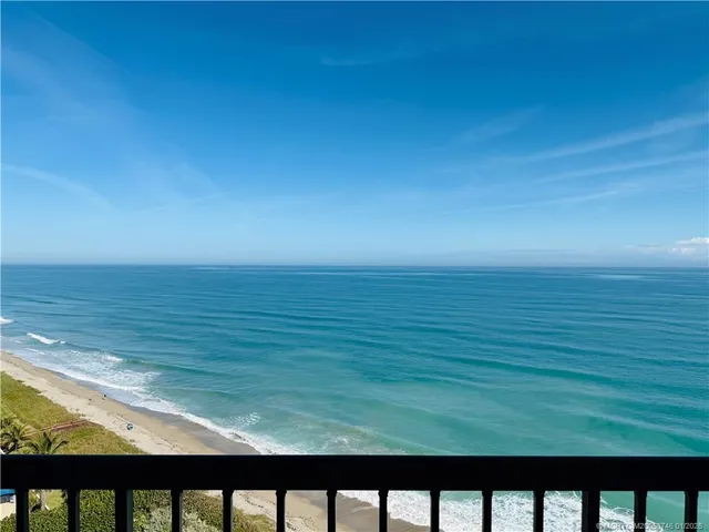 a bedroom with a bed next to a window with outer view