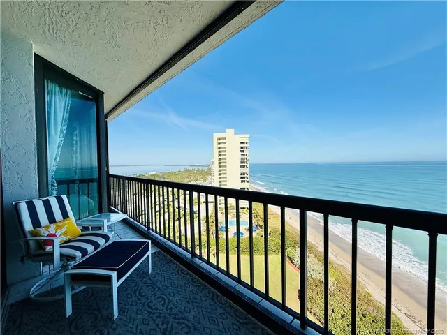 a bathroom with a sink a toilet and a shower curtain