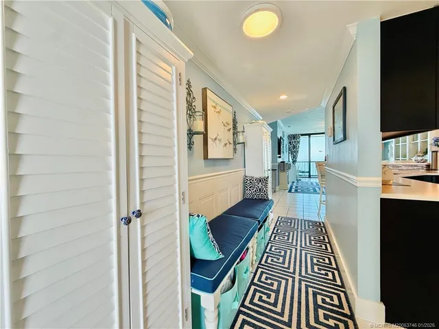 a kitchen with stainless steel appliances granite countertop a refrigerator a sink and wooden cabinets