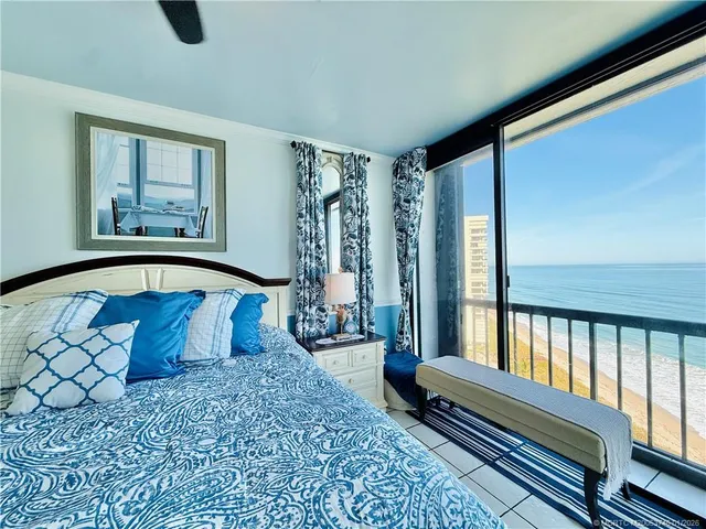 a swimming pool with outdoor seating and yard