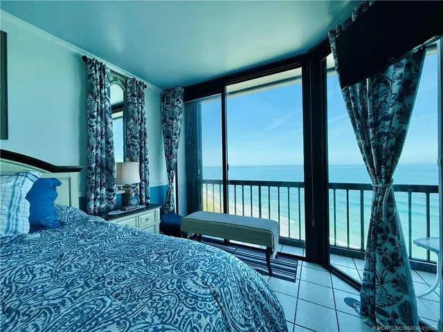 a view of a swimming pool with sitting area