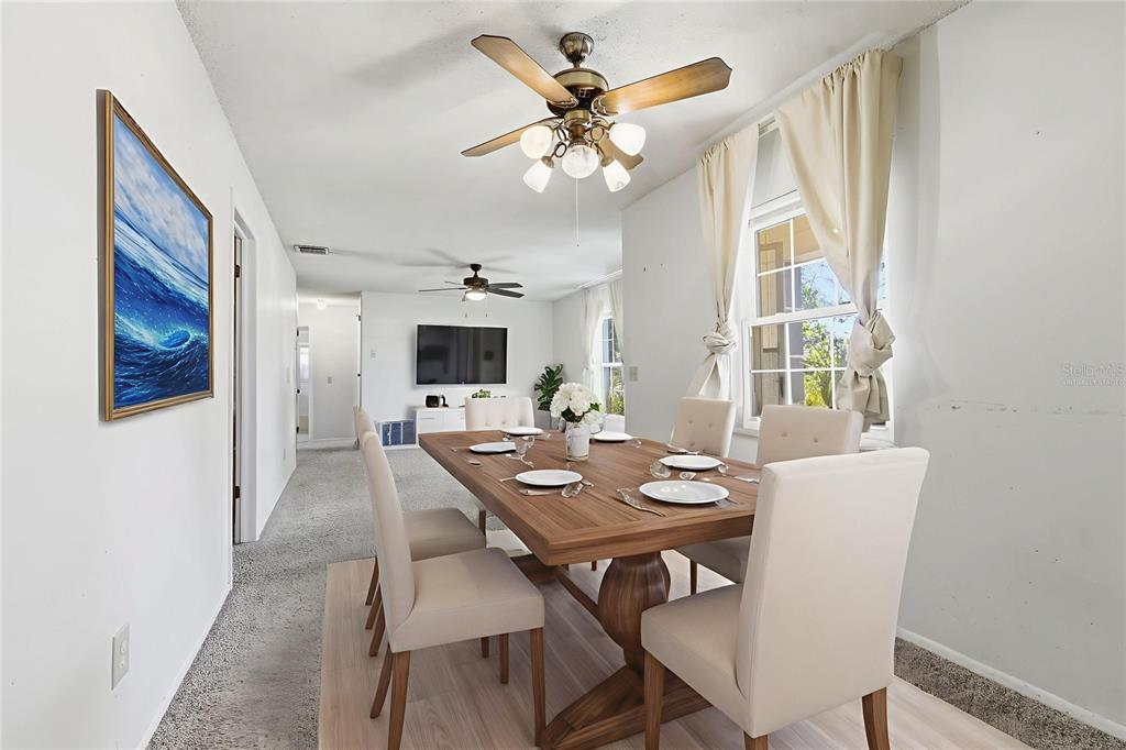 520 Jupiter Way Casselberry, FL 32707 - Photo 13 of 49 a view of a dining room with furniture and a chandelier