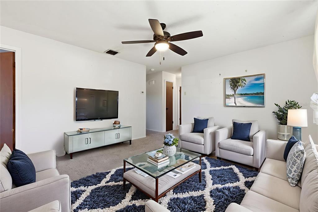520 Jupiter Way Casselberry, FL 32707 - Photo 15 of 49 a living room with furniture and a flat screen tv