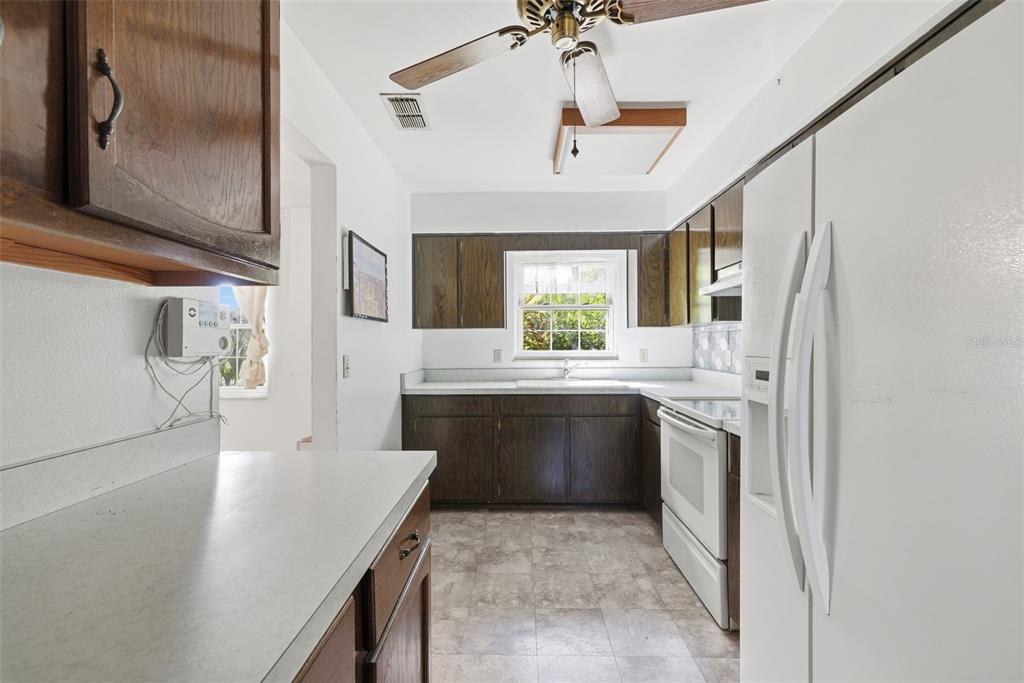 520 Jupiter Way Casselberry, FL 32707 - Photo 20 of 49 a large kitchen with a sink and refrigerator