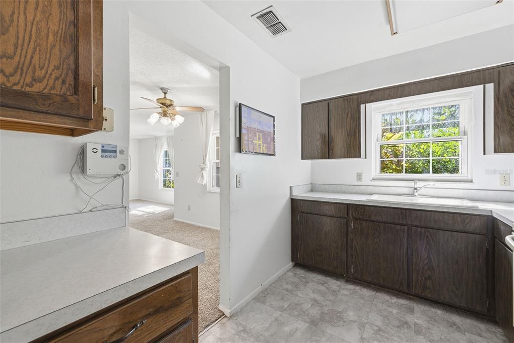 520 Jupiter Way Casselberry, FL 32707 - Photo 21 of 49 a kitchen with a sink and a stove top oven