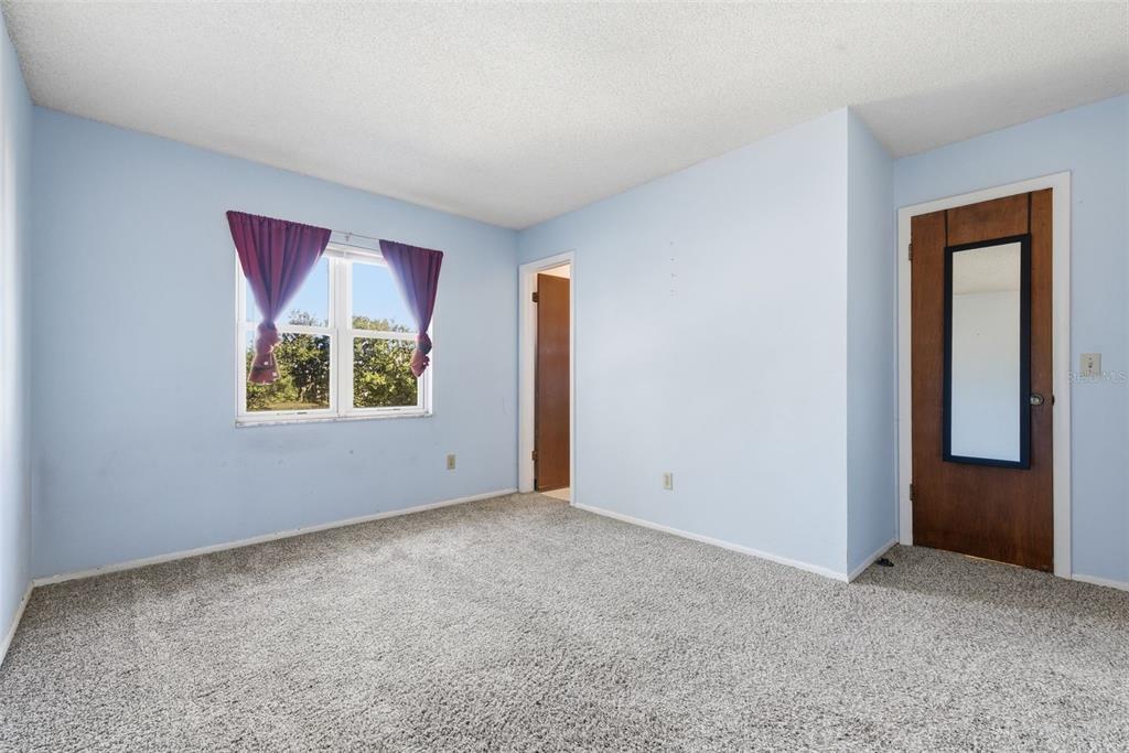 520 Jupiter Way Casselberry, FL 32707 - Photo 24 of 49 an empty room with windows and closet