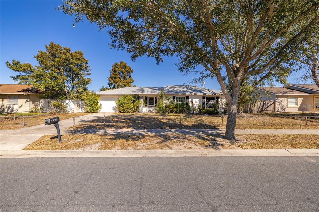520 Jupiter Way Casselberry, FL 32707 - Photo 3 of 49 a view of a house with garden and trees