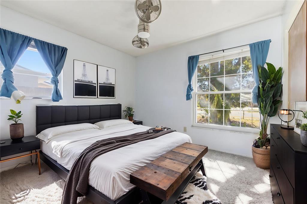 520 Jupiter Way Casselberry, FL 32707 - Photo 31 of 49 a bedroom with a bed flat screen tv and window