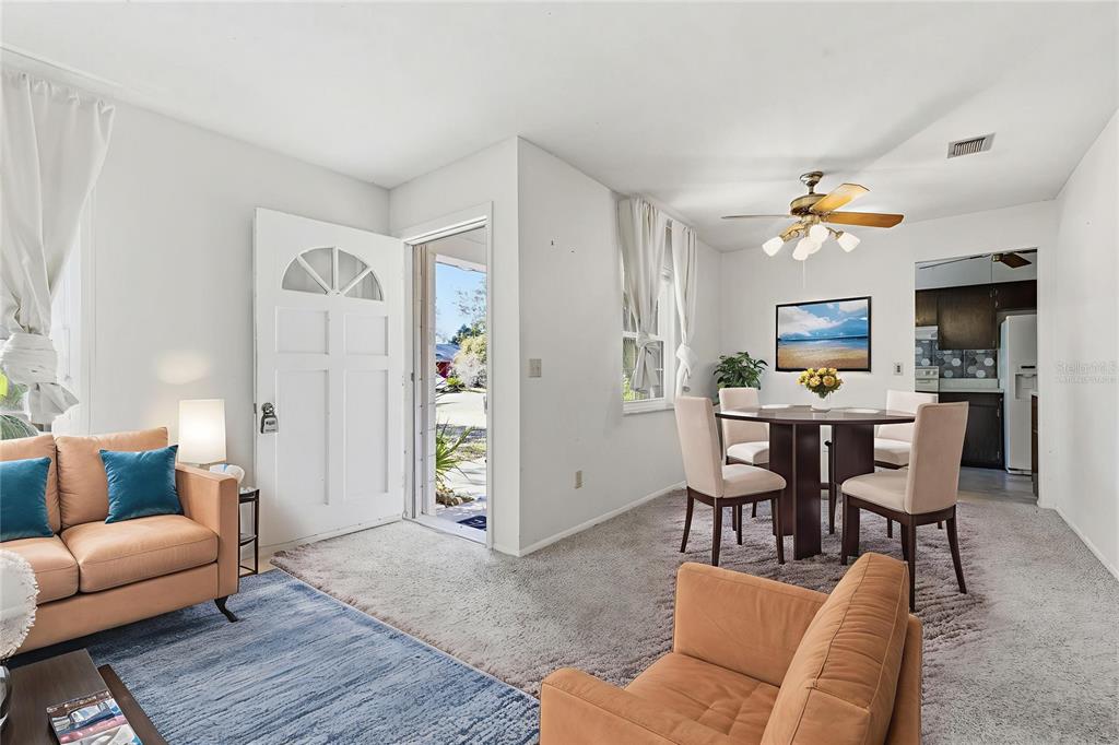 520 Jupiter Way Casselberry, FL 32707 - Photo 7 of 49 a view of a livingroom with furniture and a workspace