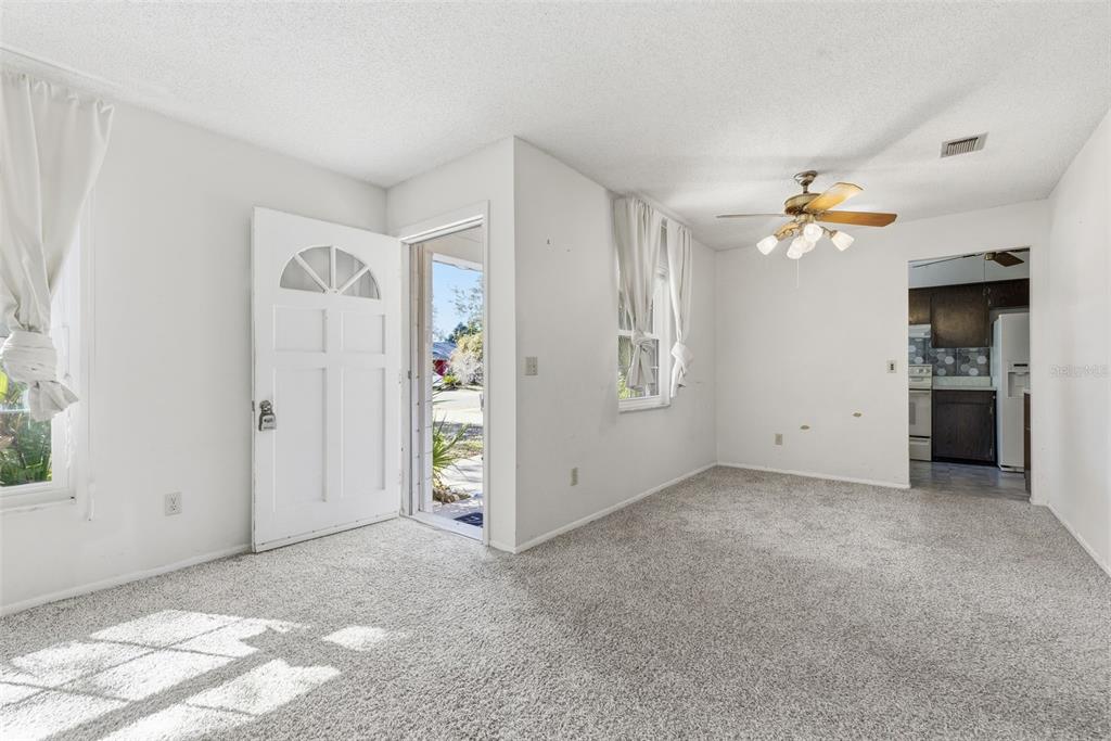 520 Jupiter Way Casselberry, FL 32707 - Photo 8 of 49 an empty room with closet and a chandelier fan