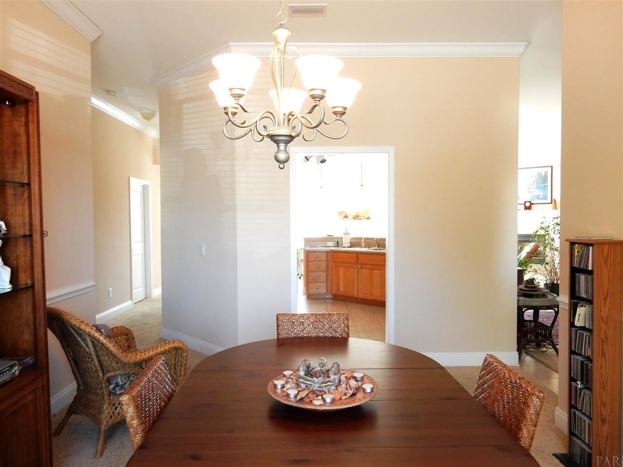 32615 Arbor Ridge Circle Lillian, AL 36549 - Photo 14 of 27 a view of a dining room with furniture