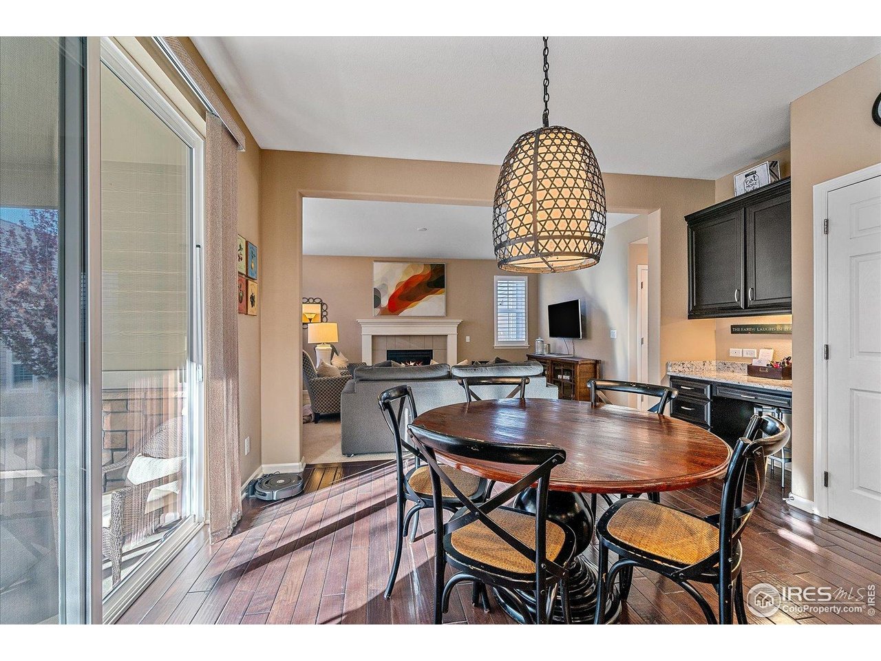 4545 South Monaco Street, Unit 324 Denver, CO 80237 - Photo 17 of 36 a dining room with furniture window and wooden floor