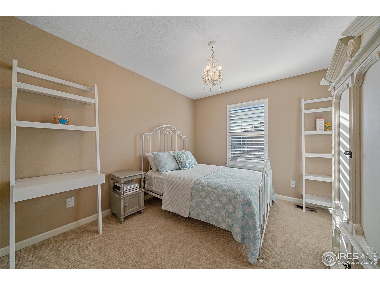 4545 South Monaco Street, Unit 324 Denver, CO 80237 - Photo 22 of 36 a bedroom with a bed and a window