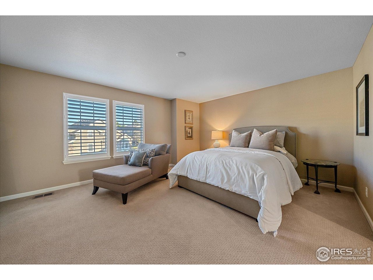 4545 South Monaco Street, Unit 324 Denver, CO 80237 - Photo 25 of 36 a bedroom with a bed and a couch