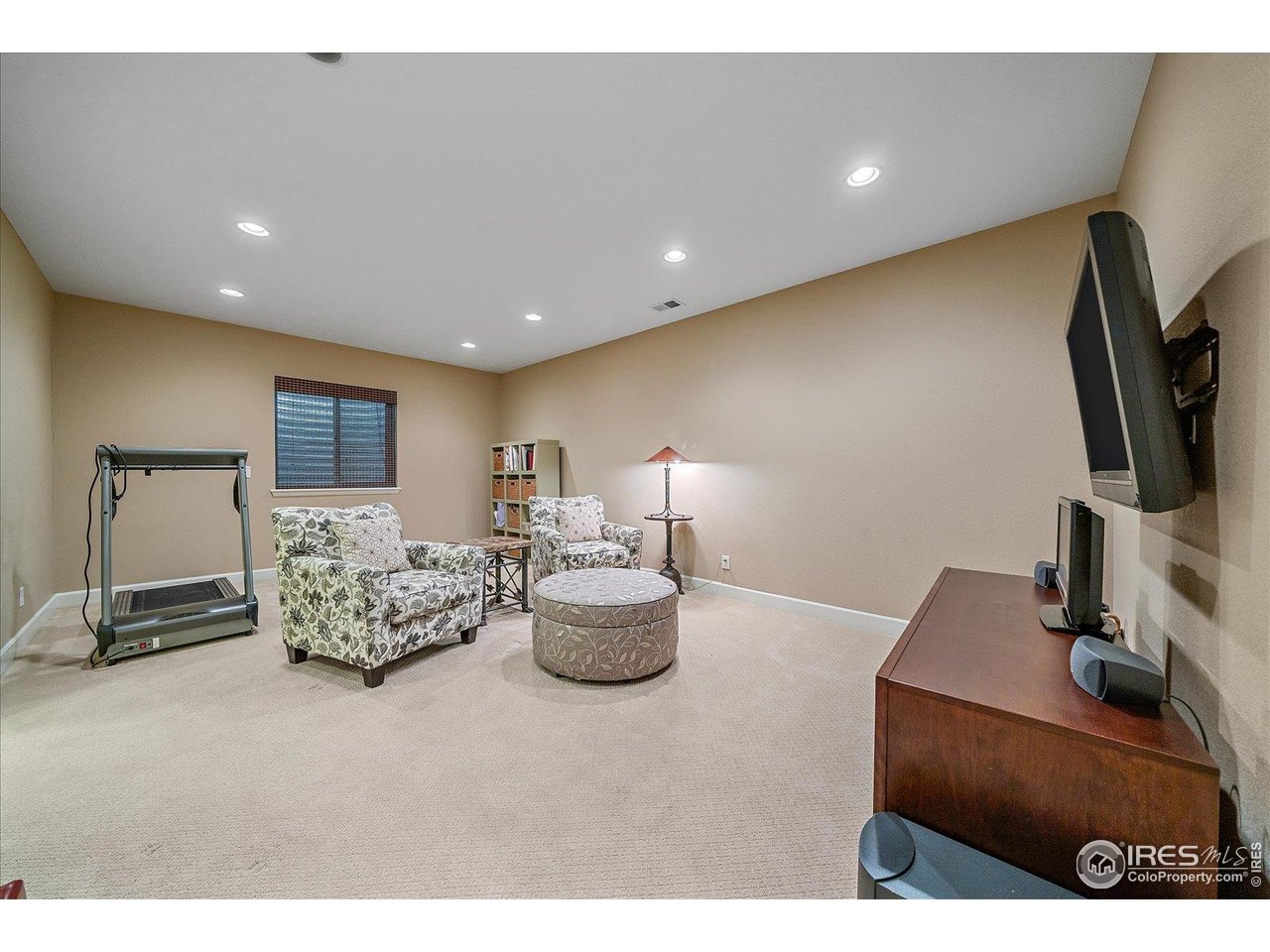 4545 South Monaco Street, Unit 324 Denver, CO 80237 - Photo 29 of 36 a living room with furniture and a flat screen tv