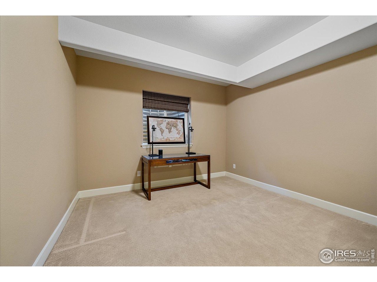 4545 South Monaco Street, Unit 324 Denver, CO 80237 - Photo 32 of 36 a hallway with a bench