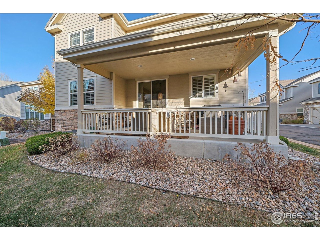 4545 South Monaco Street, Unit 324 Denver, CO 80237 - Photo 35 of 36 a view of a house with a small yard and wooden fence
