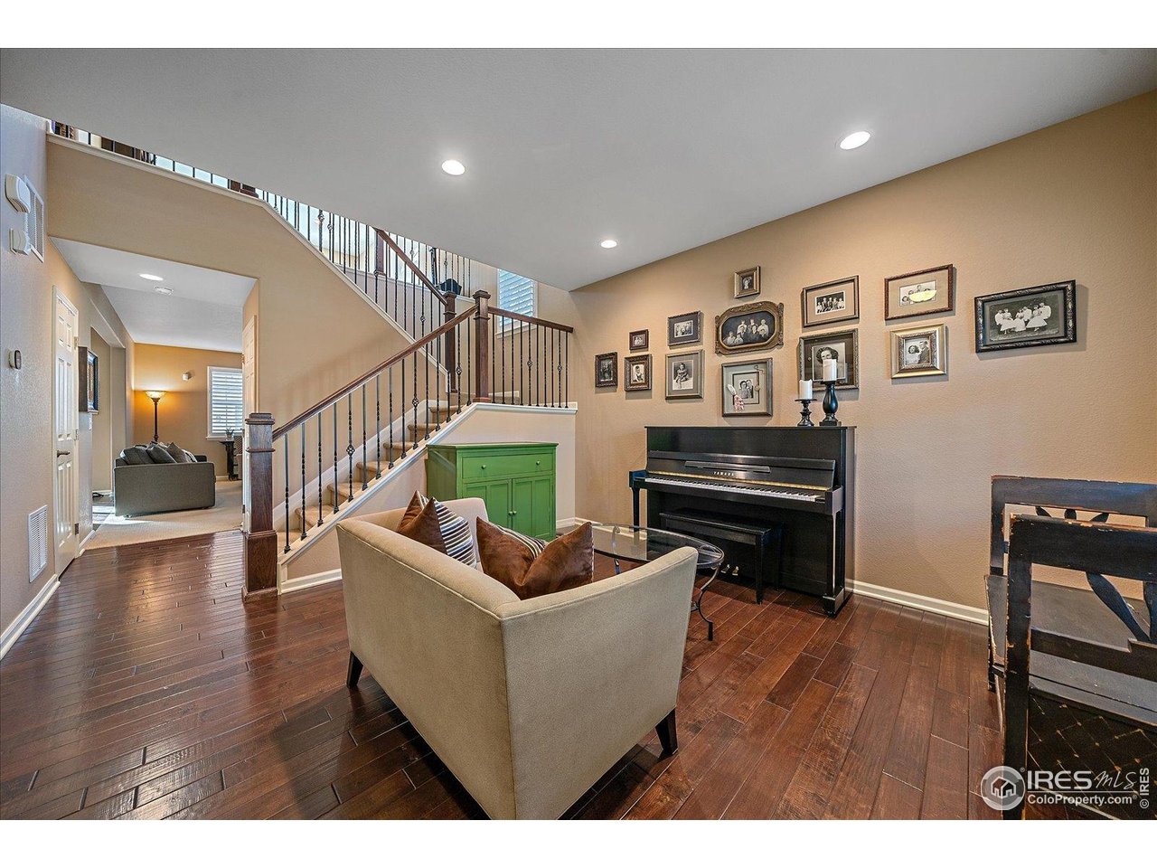 4545 South Monaco Street, Unit 324 Denver, CO 80237 - Photo 5 of 36 a living room with furniture and a wooden floor
