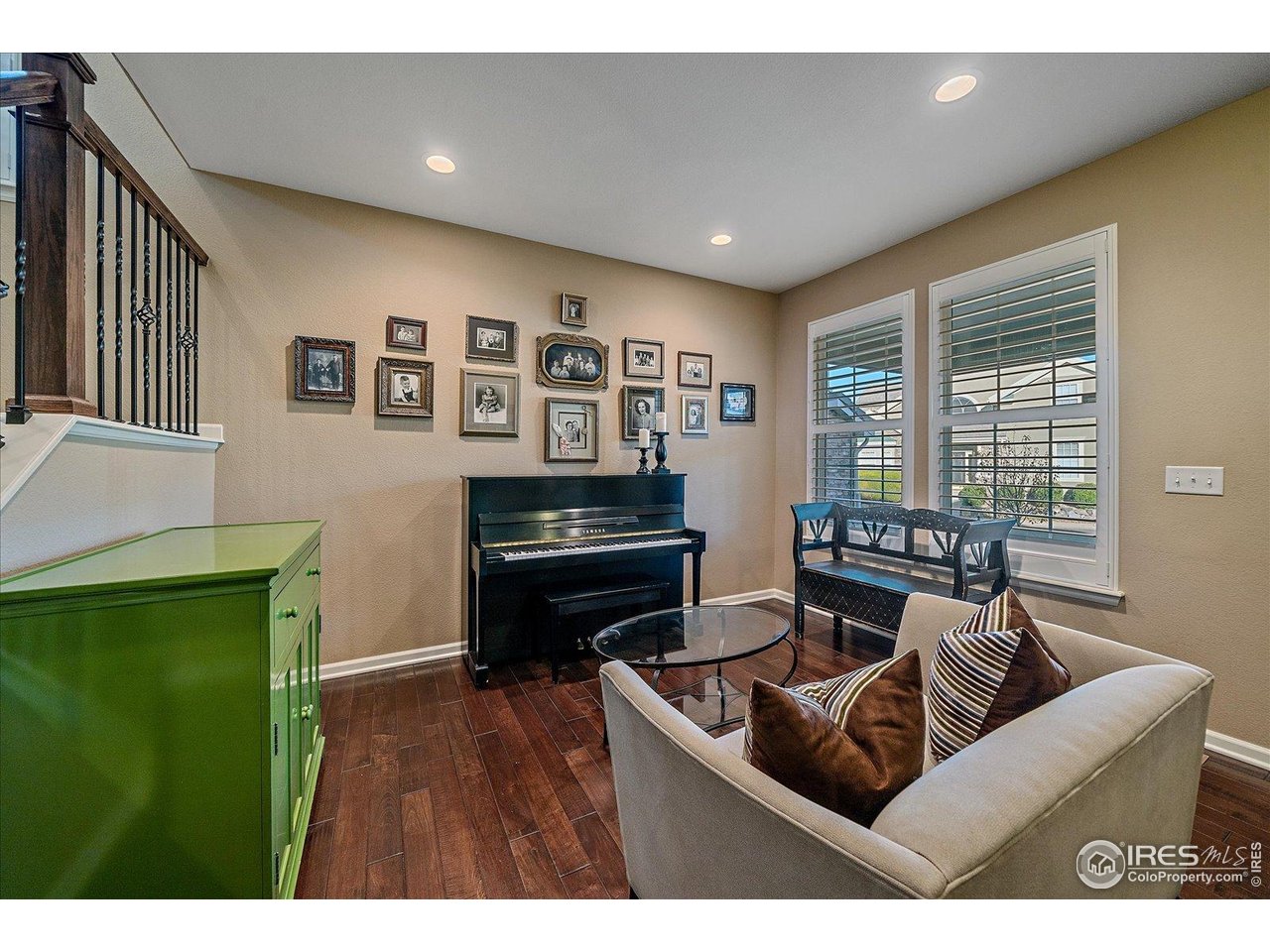 4545 South Monaco Street, Unit 324 Denver, CO 80237 - Photo 7 of 36 a living room with furniture and a piano