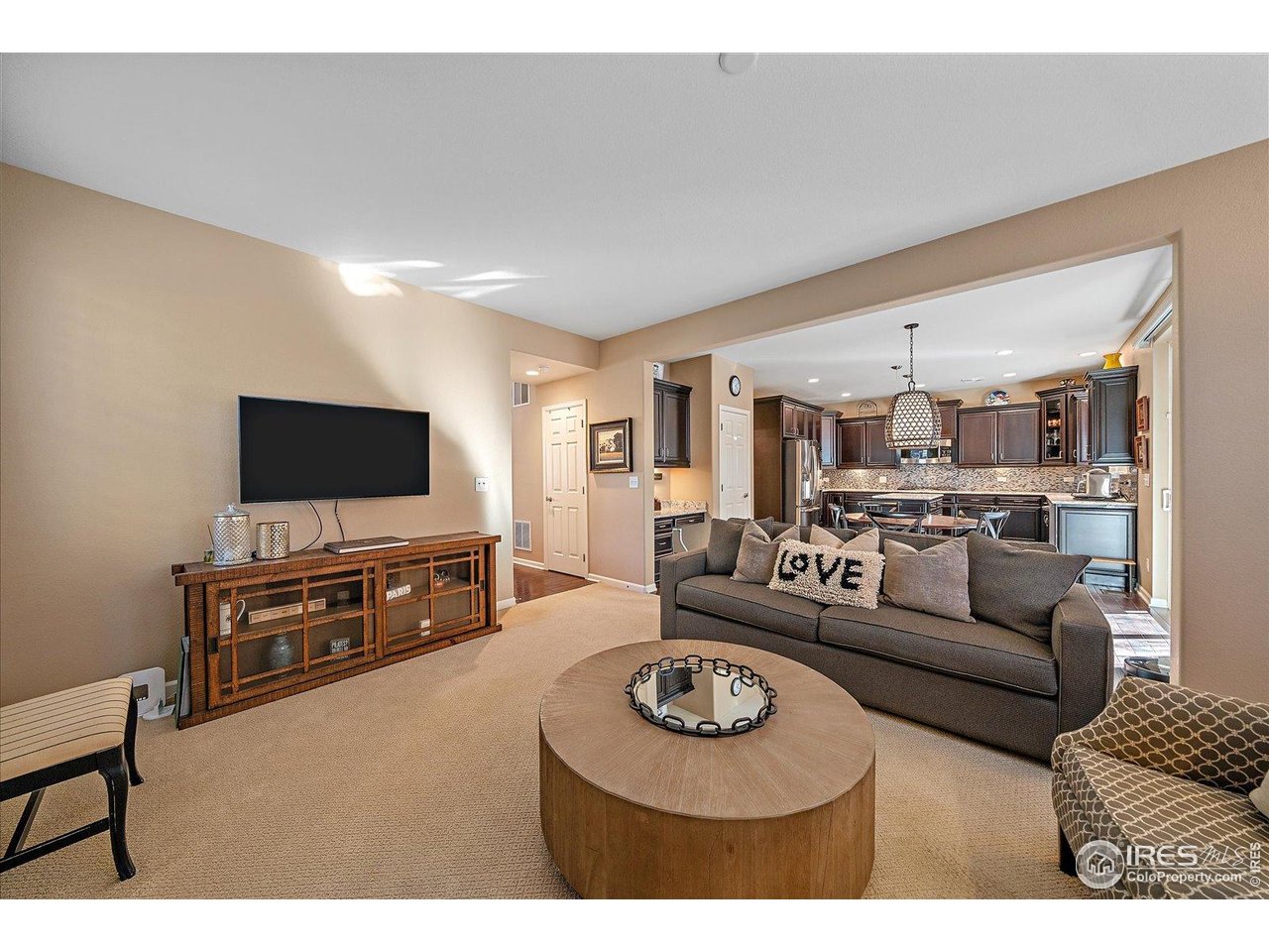 4545 South Monaco Street, Unit 324 Denver, CO 80237 - Photo 10 of 36 a living room with furniture and a flat screen tv