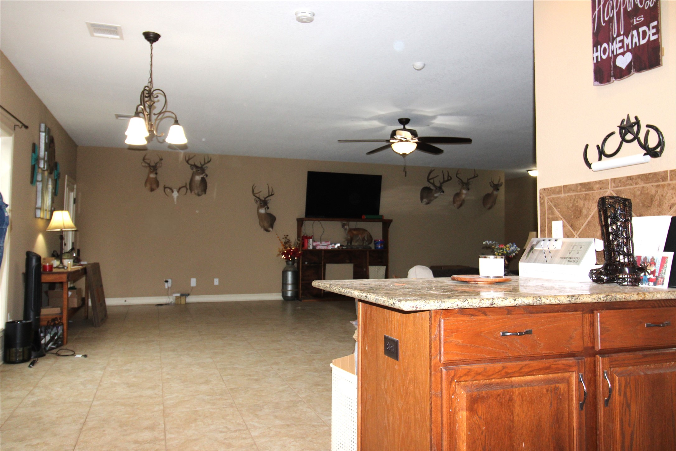 14620 Lyric Road Conroe, TX 77302 - Photo 15 of 43 a dining room with a sink and chandelier