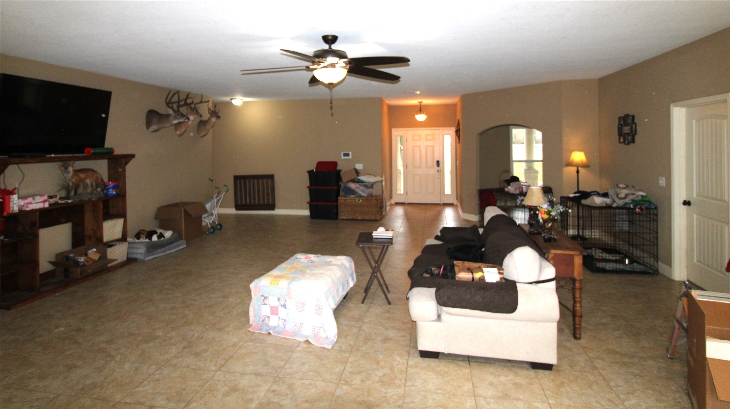 14620 Lyric Road Conroe, TX 77302 - Photo 16 of 43 a living room with furniture and a flat screen tv