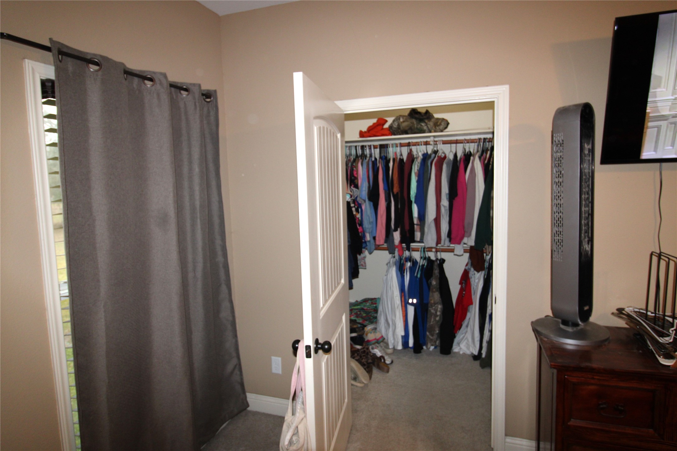 14620 Lyric Road Conroe, TX 77302 - Photo 19 of 43 a view of walk in closet with clothes