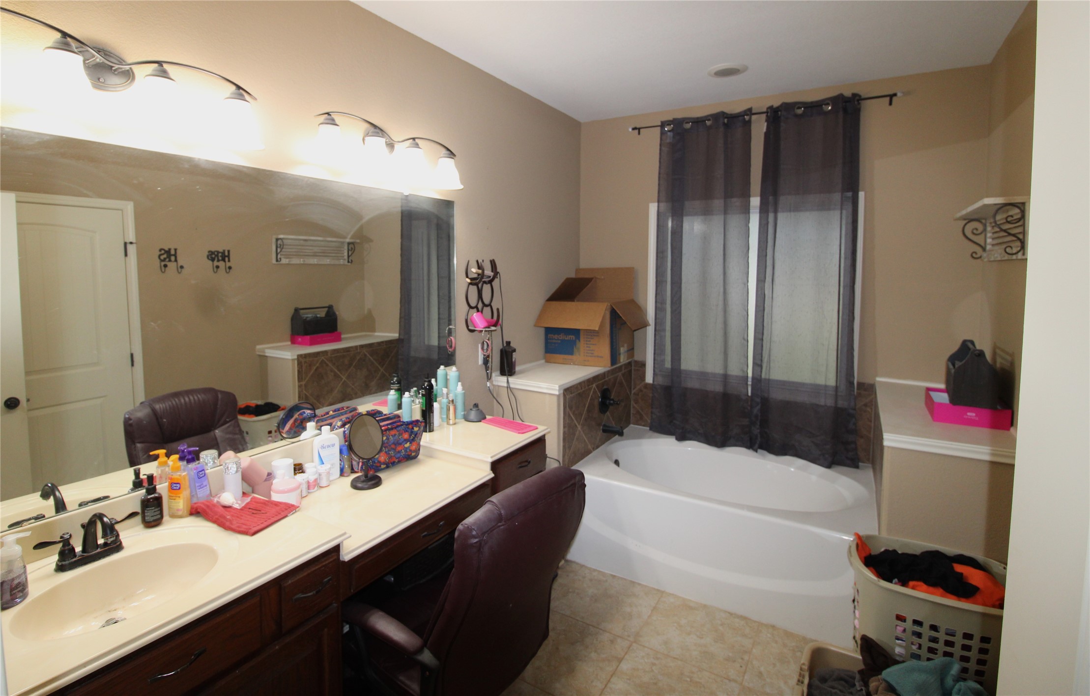 14620 Lyric Road Conroe, TX 77302 - Photo 21 of 43 a bathroom with a bathtub shower sink and toilet