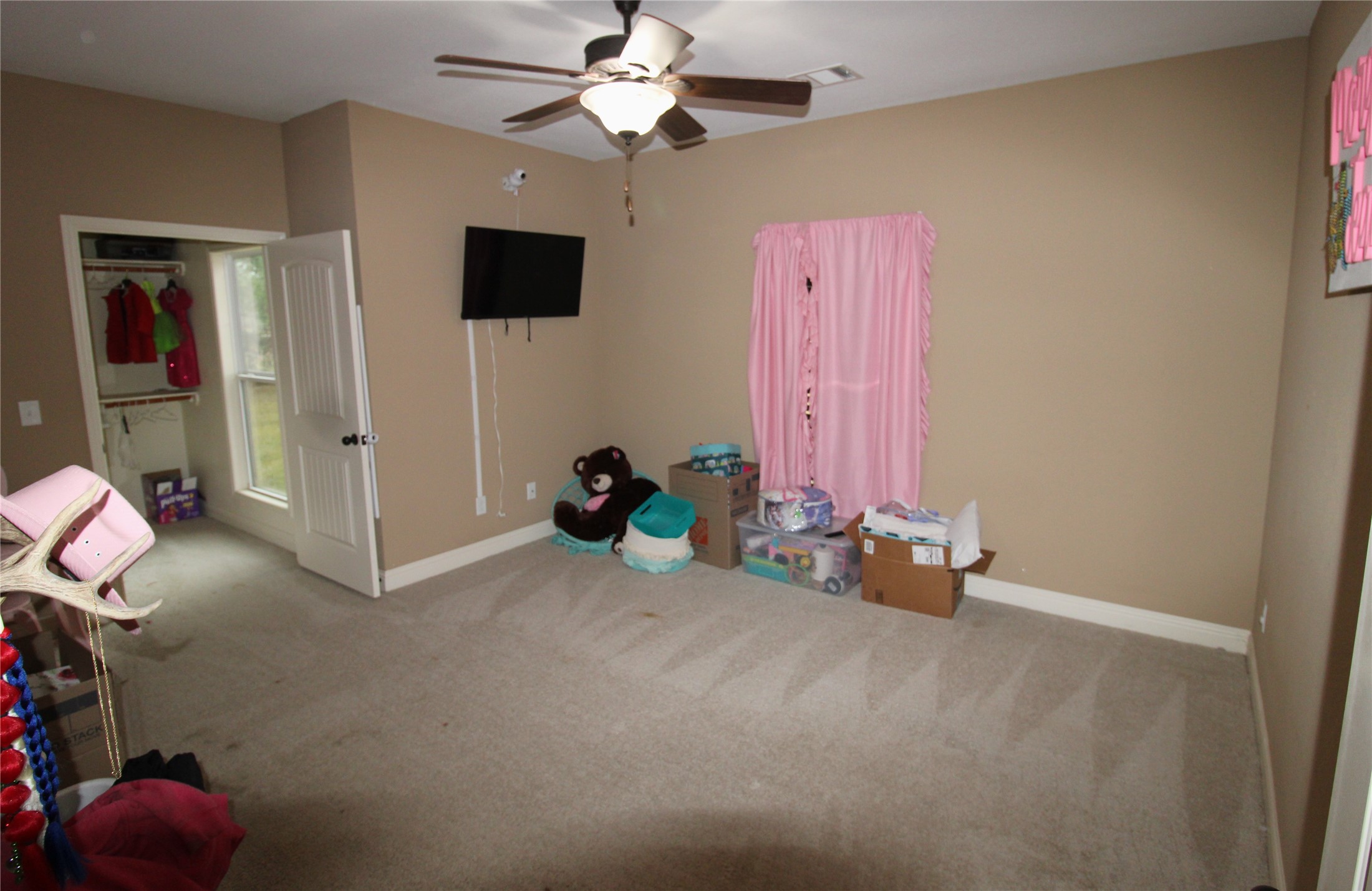 14620 Lyric Road Conroe, TX 77302 - Photo 27 of 43 a view of game room with window and ceiling fan