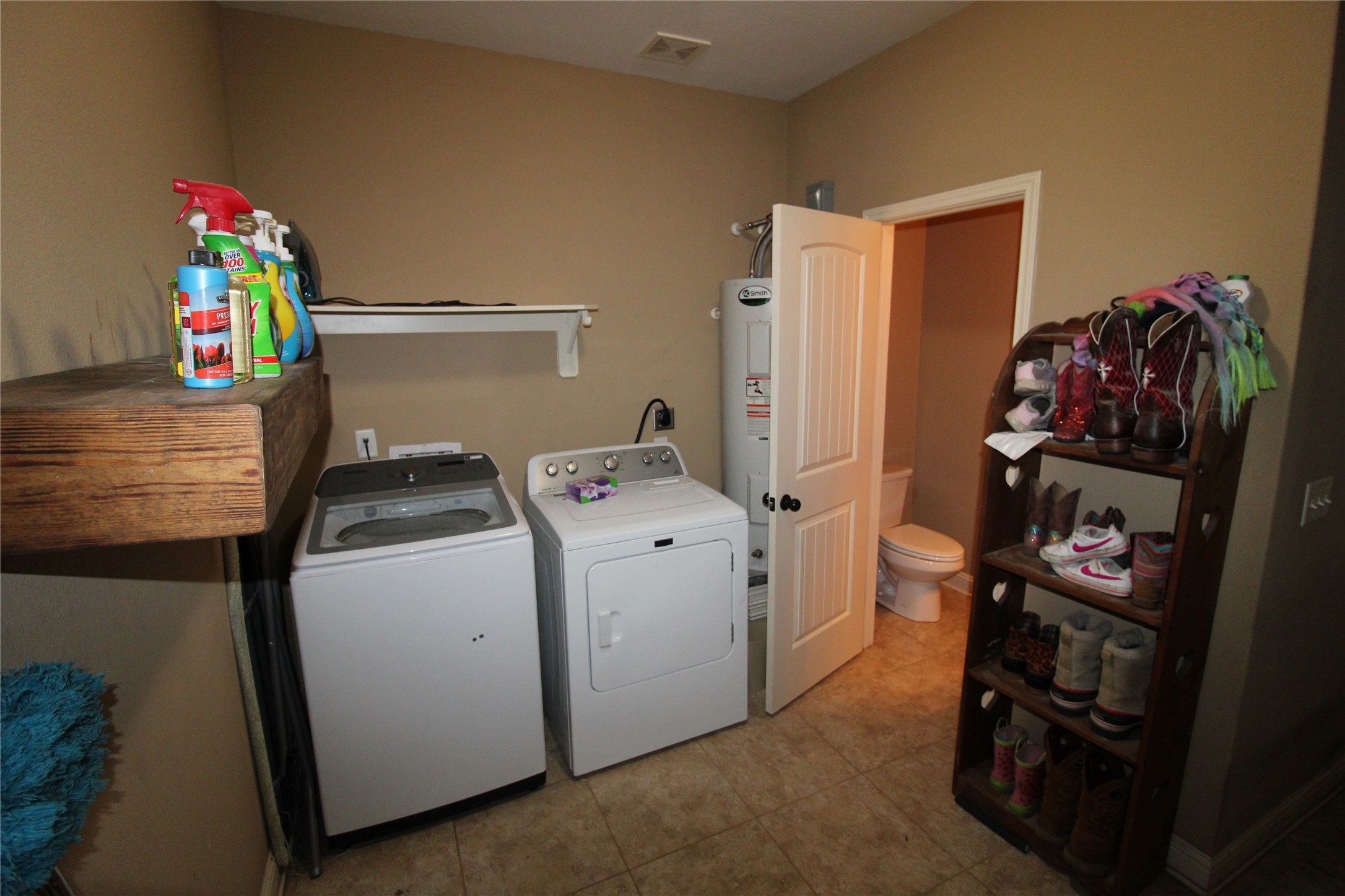 14620 Lyric Road Conroe, TX 77302 - Photo 30 of 43 a utility room with dryer and washer