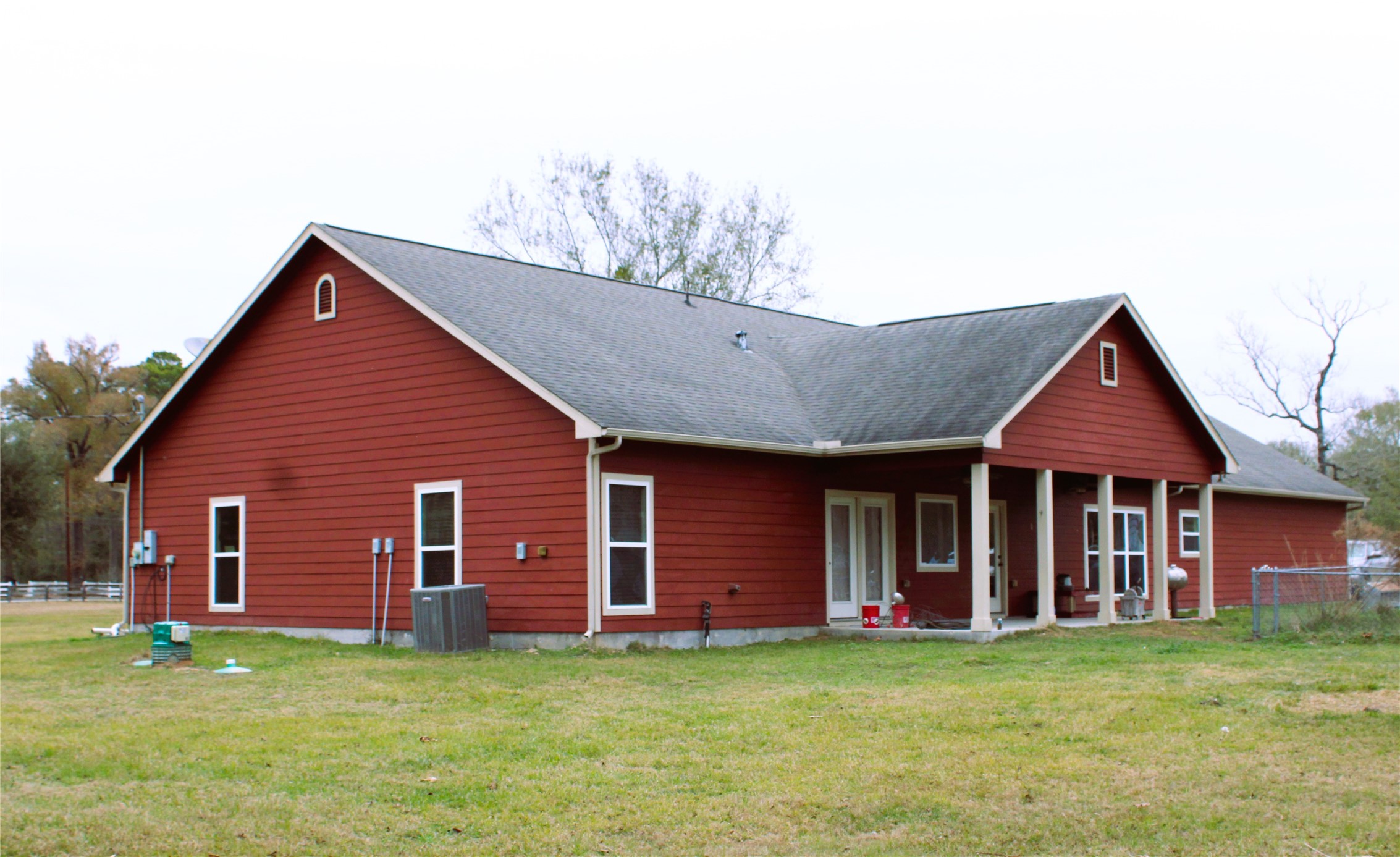 14620 Lyric Road Conroe, TX 77302 - Photo 32 of 43 a front view of a house with a garden