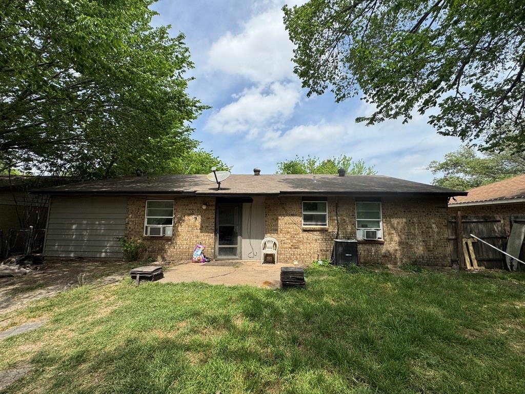 2429 February Lane Grand Prairie, TX 75050 - Photo 2 of 14 a front view of a house with patio