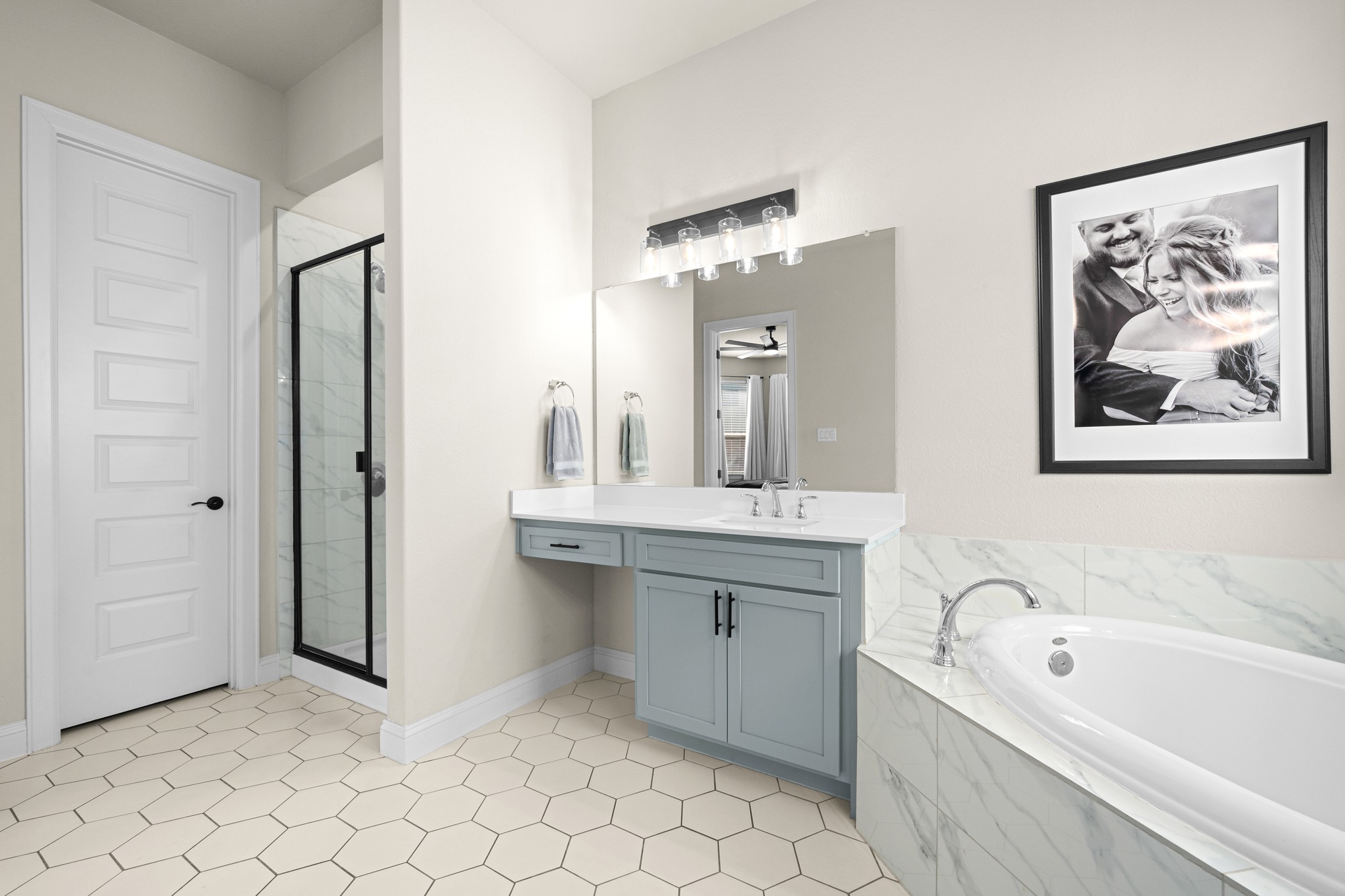 2100 Highland Ridge Road Georgetown, TX 78628 - Photo 19 of 30 A well-appointed bathroom features a spacious soaking tub, an elegant vanity, and a sleek shower.