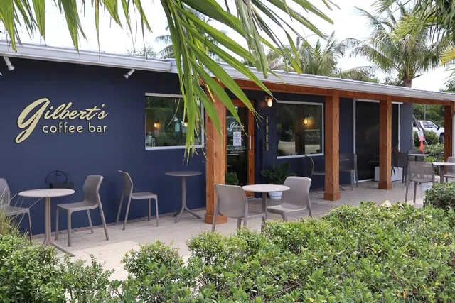 a building outdoor space with patio furniture and potted plants