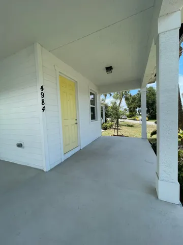 a view of a porch with furniture