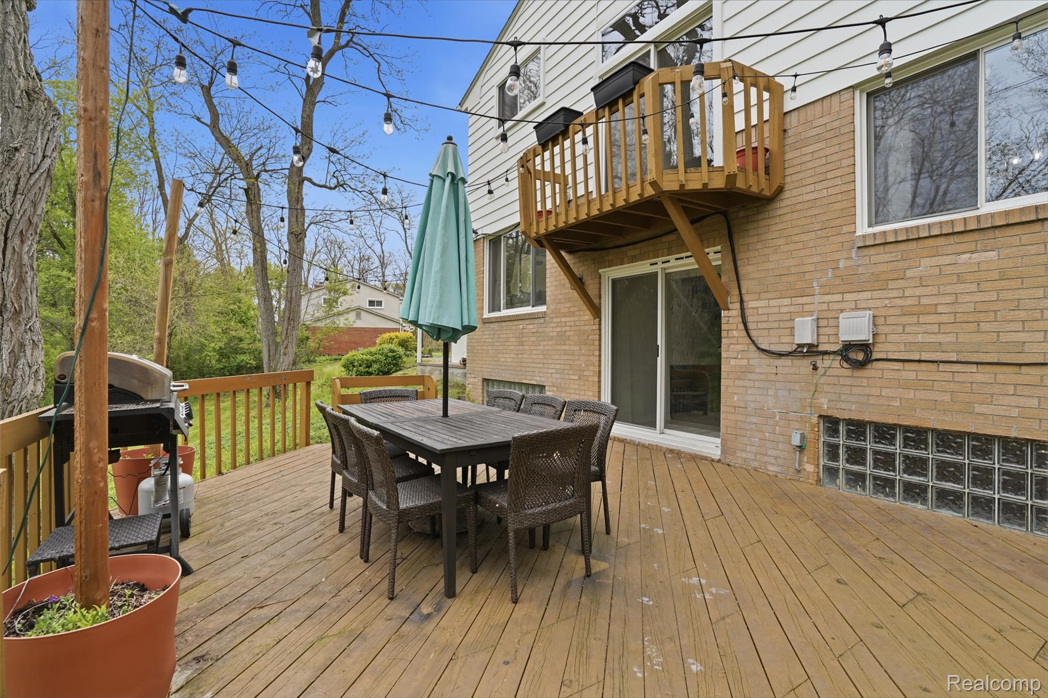 47129 Dunsany Road Northville, MI 48167 - Photo 36 of 49 Wooden deck featuring outdoor dining area and area for grilling