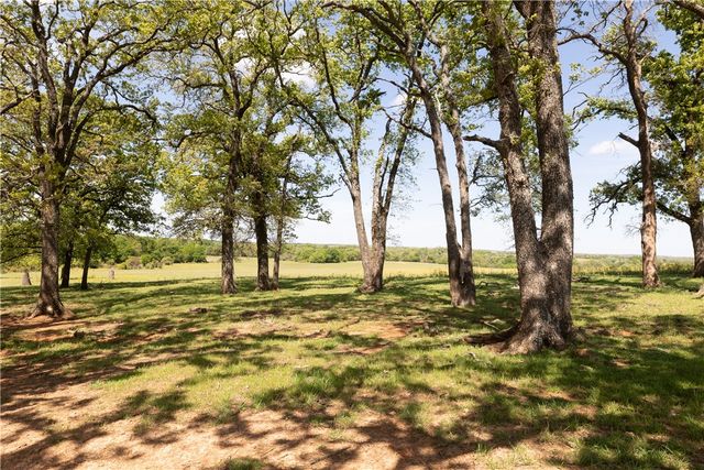 a view of a lake with houses in the background