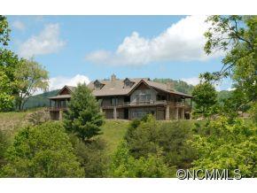 145 Fieldstone Road Clyde, NC 28721 - Photo 1 of 24 a front view of a house with a garden