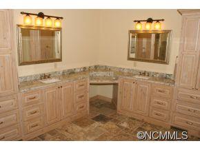145 Fieldstone Road Clyde, NC 28721 - Photo 16 of 24 a bathroom with a sink and a mirror