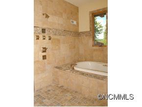 145 Fieldstone Road Clyde, NC 28721 - Photo 17 of 24 a bathroom with a shower