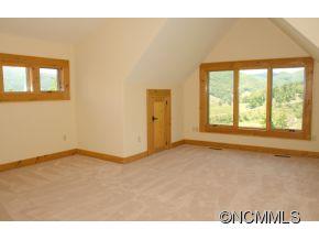 145 Fieldstone Road Clyde, NC 28721 - Photo 21 of 24 a view of an empty room with a window