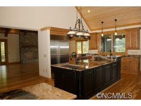145 Fieldstone Road Clyde, NC 28721 - Photo 6 of 24 a kitchen with a sink and cabinets