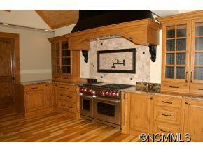145 Fieldstone Road Clyde, NC 28721 - Photo 7 of 24 a kitchen that has a sink and a stove
