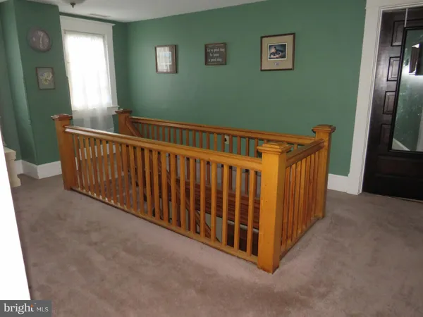 a view of a hallway with windows