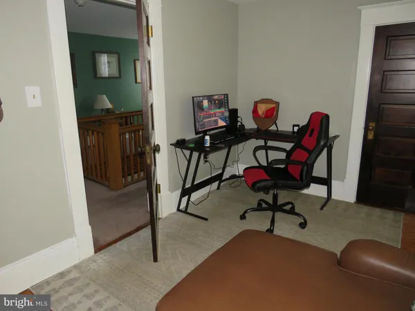 a workspace with furniture and window