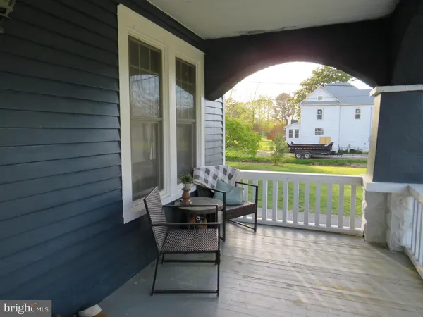 a dining room with furniture and a window