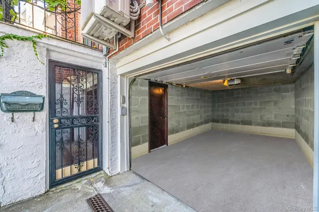 a view of a hallway with wooden floor and a glass door