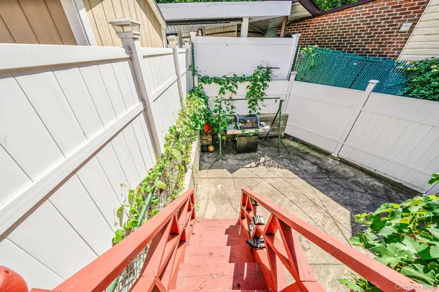 a picture of a bench in front of a building