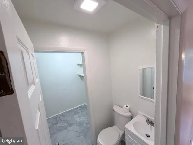 a bathroom with a toilet and a sink