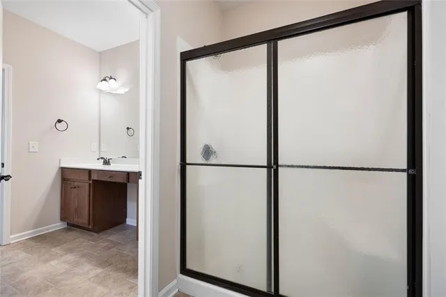 a view of a kitchen with a refrigerator and a sink